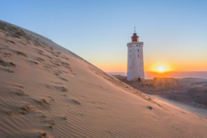 Lighthouse and Dune Rubjerg Knude at Sunset, Løkken, Lokken, North Jutland, Denmark Lighthouse and Dune Rubjerg Knude at Sunset, Løkken, Lokken, North Jutland, Denmark